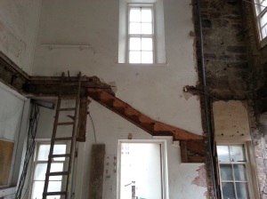 The flat stairs have been removed to create the new gathering space and upper meeting rooms
